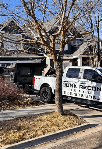 Junk removal truck at residential home